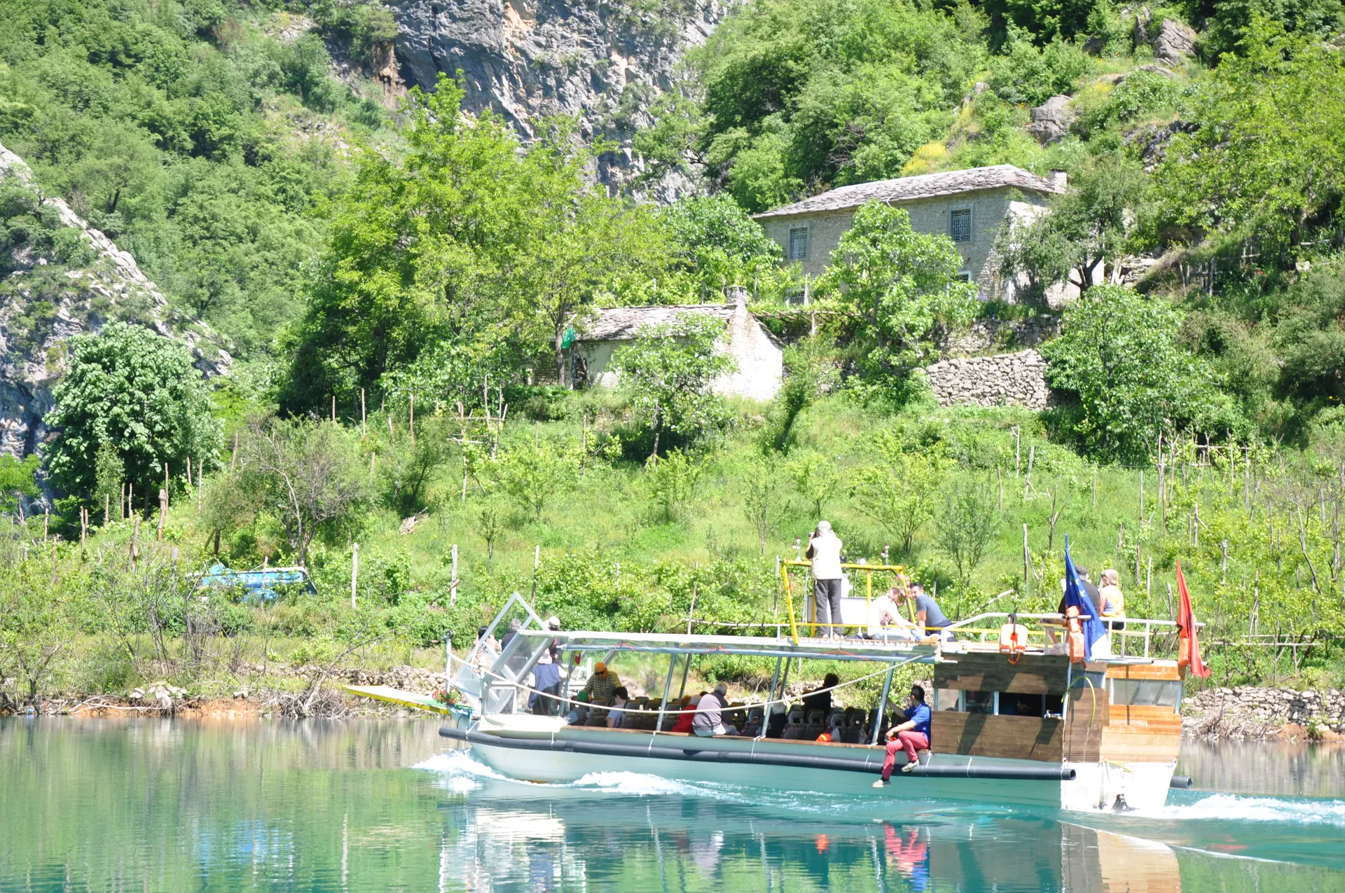 Traditional stone 'Kulla' house perched precariously on the steep mountain slopes.