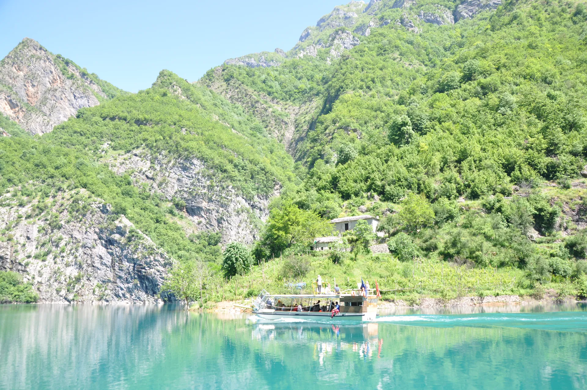 Intense turquoise waters of a shallow bay, perfect for swimming and relaxation.