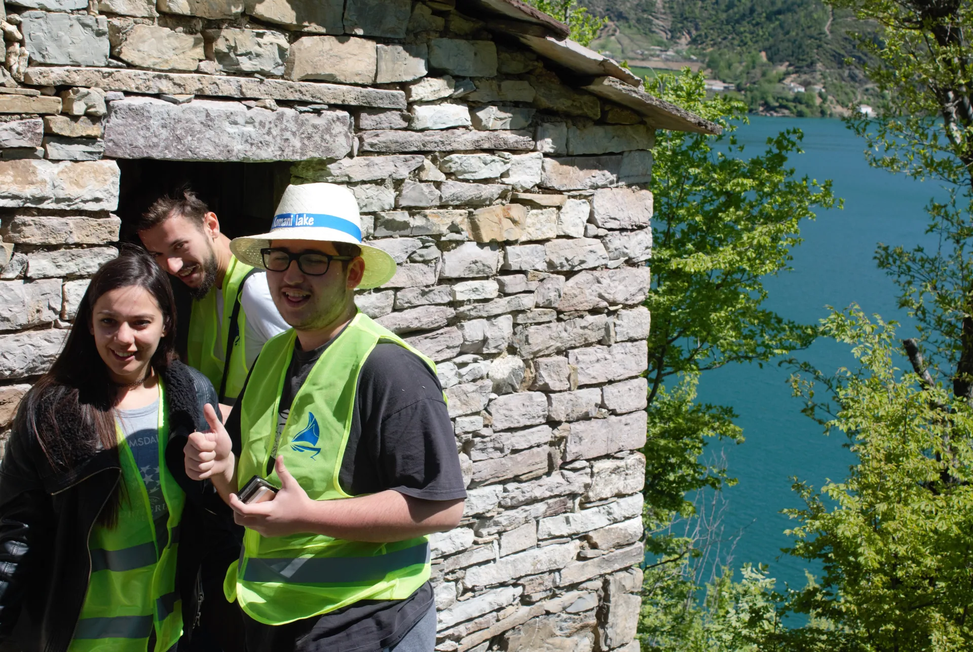 Turists visiting a traditional stone shepherd's hut nestled in the Accursed Mountains.