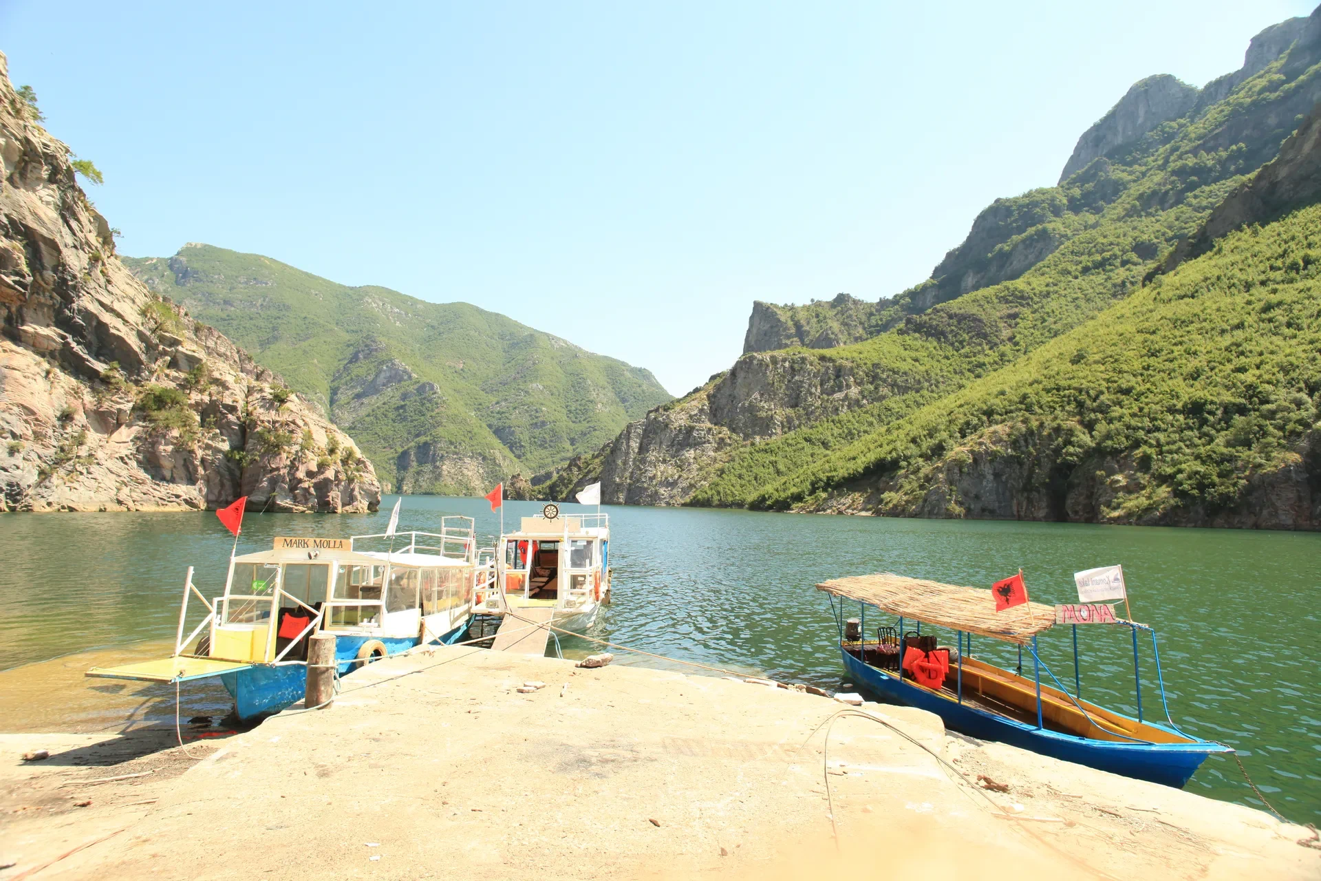 Tour boat docked at the pier ready for departure.